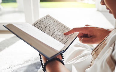 Image showing Reading book, Islamic or hands of man with Quran on Eid Mubarak praying to God or worship at home. Allah, hope or Ramadan with spiritual person learning Muslim info for faith, religion and gratitude