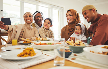 Image showing Food, selfie and muslim with big family at table for eid mubarak, Islamic celebration and lunch. Ramadan festival, culture and iftar with people eating at home for fasting, islam and religion holiday