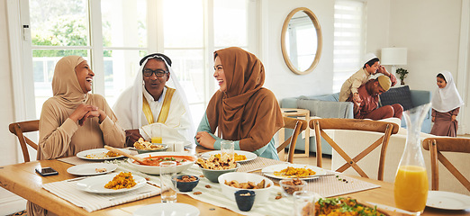 Image showing Food, relax and muslim with big family at table for eid mubarak, Islamic celebration and lunch. Ramadan festival, culture and iftar with people eating at home for fasting, islam and religion holiday