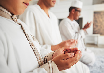 Image showing Prayer, muslim and dua with hands of family on living room floor for eid mubarak, God and worship. Quran, islamic and Ramadan with spiritual people praying at home for faith, religion and gratitude