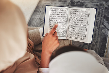 Image showing Prayer, muslim and Quran with child and learning for eid mubarak, God and worship. Islamic, hope and Ramadan with hands of family teaching arabic on mat at home for faith, religion and gratitude