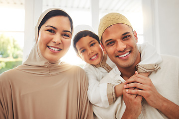 Image showing Portrait, hug and happy muslim family of mother, father and child smile, bond and enjoy quality time together. Living room, home happiness and face of Islamic mom, kid and Arabic dad embrace for love