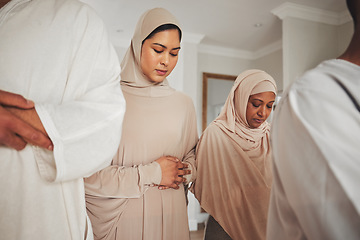 Image showing Prayer, muslim and islamic with women in living room for eid mubarak, God and worship. Quran, hope and Ramadan with spiritual family praying dua at home for faith, religion and gratitude