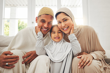 Image showing Portrait of parents, child on sofa and Islam, smile for Eid with mom, dad and daughter with home culture in Indonesia. Muslim man, woman in hijab and kid, happy family at Ramadan on sofa together.