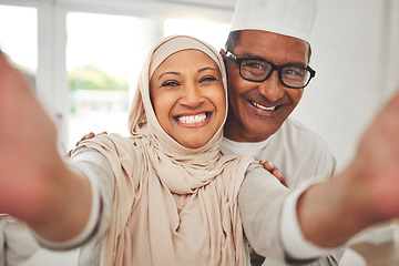 Image showing Selfie, Islam and old couple in home with smile, happy culture and love in living room in Indonesia. Marriage, senior man and woman in hijab on sofa in respect, religion and face for social media.