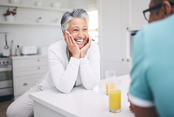 Image showing Senior couple, love and conversation in kitchen with juice for quality time or happy in retirement. Smile, marriage and elderly woman or man with beverage in home for bonding on weekend or to relax.