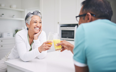 Image showing Senior couple, smile and cheers in a kitchen with toast and love celebration drink. Home, juice and cocktail together of elderly man and woman happy of support and care with marriage and anniversary