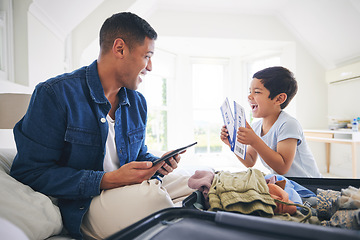 Image showing Plane ticket, luggage and father with excited family and holiday suitcase with dad and son. Home, bag and helping in a bedroom for vacation and packing with papa and boy kid together with a smile