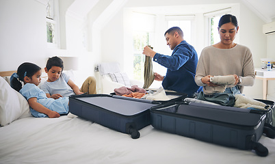 Image showing Travel, luggage and home with family and holiday suitcase with mom, dad and children. House, bag and helping in a bedroom for vacation and journey with mother, father and kids together by bed