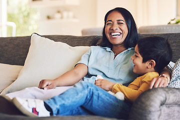 Image showing Funny, mother and boy on a couch, love and quality time with happiness, hug and cheerful. Female parent, happy mom and mama with male child, kid on a sofa and family in a home, laughing and relax