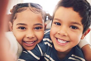 Image showing Kids, brother and sister with selfie, portrait and smile in home with hug, care and bonding together. Happy sibling children, photography and profile picture for social media, blog or memory in house