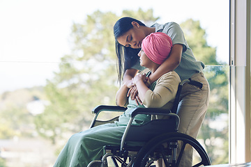 Image showing Senior mother, woman and hug with wheelchair, love and care with bonding, kindness and nursing home. Girl, embrace and elderly person with disability for support, empathy or trust by window at clinic