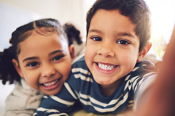 Image showing Children, girl and brother with selfie, portrait or smile in home for hug, care and bonding together. Happy sibling kids, photography and profile picture for social media, blog and memory in house