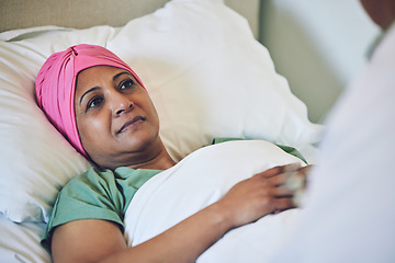 Image showing Medical, healthcare and cancer with muslim woman in bed at hospital for treatment or recovery. Islam, medicine or sad person in hospice with a sick or tired mature patient in clinic for chemotherapy