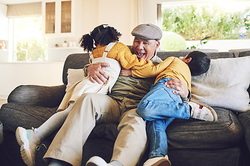 Image showing Hug, grandfather playing or happy kids in family home on sofa with love enjoying bonding time together. Smile, affection or senior grandfather relaxing with young children siblings on couch in house