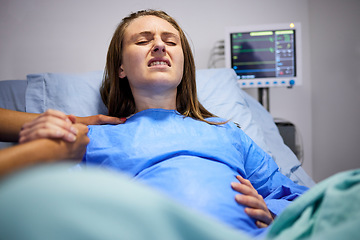 Image showing Pregnant woman, hospital and delivery with push, holding hands and support in bed, baby and pain. Strong mother, labor and helping hand in clinic bed for infant child, motivation and new life