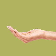 Image showing Woman, hands and palm on mockup for product placement, advertising or marketing against a studio background. Hand of female reaching out for message, copy space or advertisement in body care