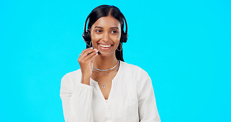 Image showing Call center, funny or laughing woman in studio for communication on blue background mockup. Friendly customer services, crm or. Indian girl in headset helping, talking or explaining for tech support