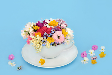 Image showing Surreal Summer Flowers and Wildflowers Teacup Arrangement