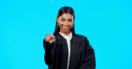 Image showing Face, Indian woman and lawyer pointing to you, judge and legal proceeding against a blue studio background. Portrait, female employee and lady with mockup, attorney and show promotion with confidence