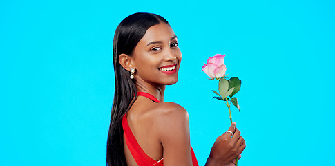 Image showing Studio face, flower and beauty woman with nature plant, sustainable agriculture portrait and natural organic product. Eco friendly makeup, floral plant and skincare person portrait on blue background