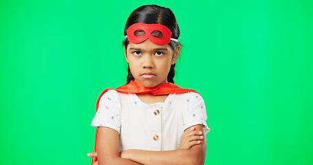 Image showing Angry, crossed arms and face of child on green screen with upset, disappointed and anger expression. Portrait, mockup studio and young girl in superhero costumer with mad, unhappy and shake head