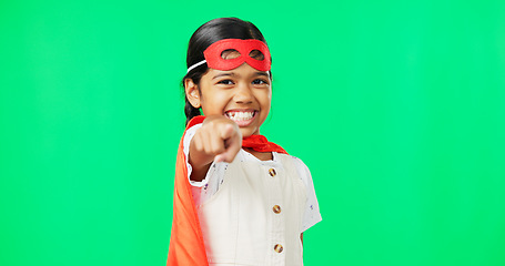 Image showing Superhero, point and face of child on green screen for fantasy, cosplay costume and comic character. Choose gesture, hero mockup and portrait of girl in studio for freedom, fight crime and games