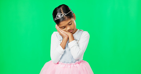 Image showing Sleeping, tired gesture and child on green screen with crown, princess costume and tutu in studio. Sadness, sleepy mockup and isolated young girl with fatigued, dreaming and nap expression for rest