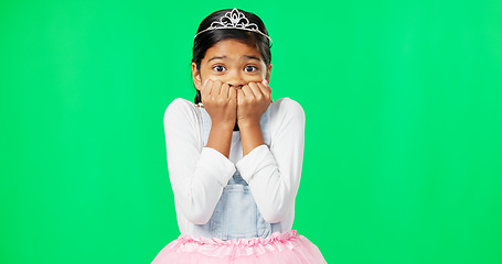 Image showing Scared, fear and child with anxiety on green screen with crown, princess costume and tutu in studio. Stress, worry mockup and isolated young girl with worried, sadness and anxious facial expression