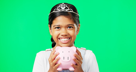 Image showing Girl, piggy bank and face with smile in studio by green screen for saving mockup, money or princess aesthetic. Happy young female, royal and fairytale portrait with cash, tiara and finance mock up