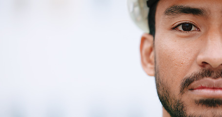 Image showing Face of construction manager wearing hardhat while standing outside on site with copy space. Closeup of civil engineer worker doing maintenance and repair work for building project