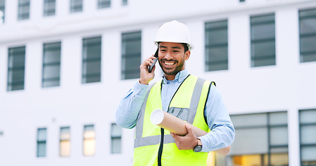 Image showing Excited, confident and happy architect talking on phone, agreeing to building plan for office development in city. Cheerful, ambitious contractor or surveryor negotiating blueprint deal on technology