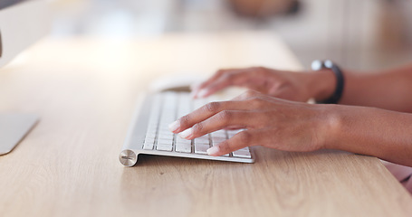 Image showing Closeup of a businesswoman browsing on a computer keyboard against a white background. Hands of a productive entrepreneur typing emails and compiling online reports while doing research and planning