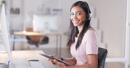 Image showing Portrait of a young female customer service agent working in ecommerce and sales. Business woman working on a tablet in her office while helping and assisting customers online with IT support