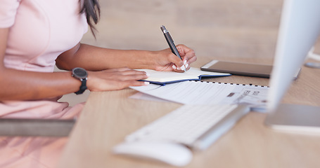 Image showing Office woman working on a schedule or online appointments and making notes in her calendar diary. One young professional therapist planning, checking and filing information on desktop computer