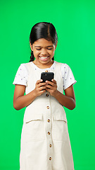 Image showing Happy, green screen and girl with smartphone, typing and laughing against a studio background. Mobile app, young person and female child with cellphone, connection and communication on social media