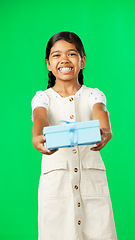 Image showing Girl child, box and gift by green screen studio in with smile, happiness or giving mockup for kindness. Kid, vertical portrait and present package on holiday, birthday party or happy childhood memory
