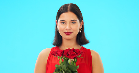 Image showing Bouquet of flowers, happy woman and face in studio, blue background and color backdrop. Portrait female model, roses and smile for floral gift of love, celebration and romantic care on valentines day