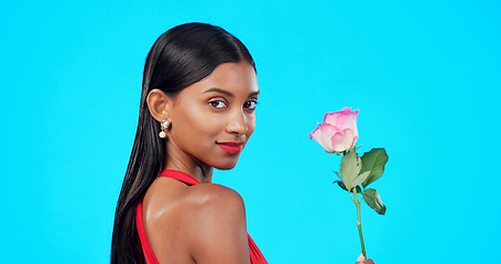 Image showing Studio face, flower and beauty woman with nature plant, sustainable agriculture portrait and natural organic product. Eco friendly makeup, floral plant and skincare person portrait on blue background