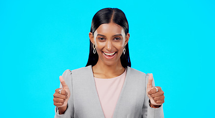 Image showing Thumbs up, happy and studio woman with business emoji gesture for congratulations, job well done or winner satisfaction. Agreement, female portrait and person dancing with yes sign on blue background