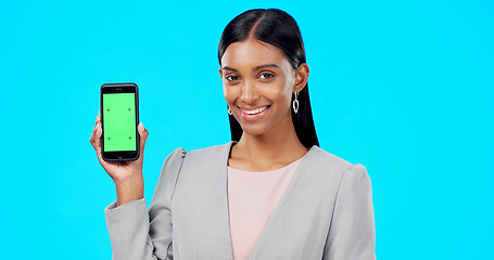 Image showing Chroma key, green screen and portrait of businesswoman with phone for product placement, branding and mobile app advertising. Smile, happy and professional female isolated in a studio blue background