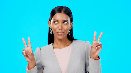 Image showing Face, smile and Indian woman with peace sign, support and happiness against blue studio background. Portrait, female and lady with smile, hand gesture and success with solidarity, winner and victory