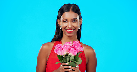 Image showing Face, flower bouquet and happy beauty woman with nature gift, sustainable agriculture portrait or natural present. Eco friendly product, floral studio roses and female person smile on blue background