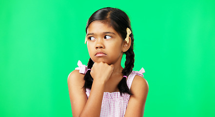 Image showing Kid, eye roll and annoyed girl with a green screen in a studio feeling bored while thinking. Think, young child and casual fashion of a student waiting, tired and isolated with youth while frustrated