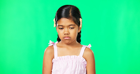 Image showing Sad, depression and face of child on green screen with upset, disappointed and unhappy facial expression. Portrait, mockup studio and isolated young girl with sadness, problem and moody for attention