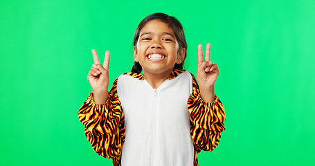 Image showing Happy, dance and peace sign with girl in studio for kindness, positive and pride. Happiness, support and gesture with young child isolated on green background for cheerful, carefree and confidence