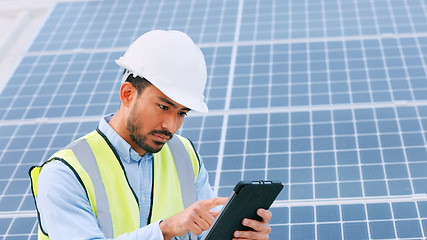 Image showing Solar, electricity and construction being done by an engineer while using a tablet for research or planning. Portrait of one young engineer browsing on technology