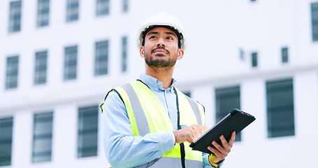 Image showing Thinking architect browsing digital tablet, analysing building plans for city planning, residential or office development. Architectural engineer or contractor checking online blueprint on technology