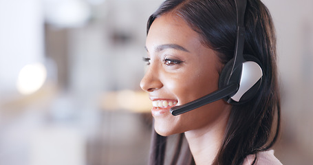 Image showing Call center agent helping client in a phone call giving great customer service. Customer support employee consulting clients online using headset. Professional friendly woman working at her desk