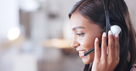 Image showing Call center agent helping client in a phone call giving great customer service. Customer support employee consulting clients online using headset. Professional friendly woman working at her desk